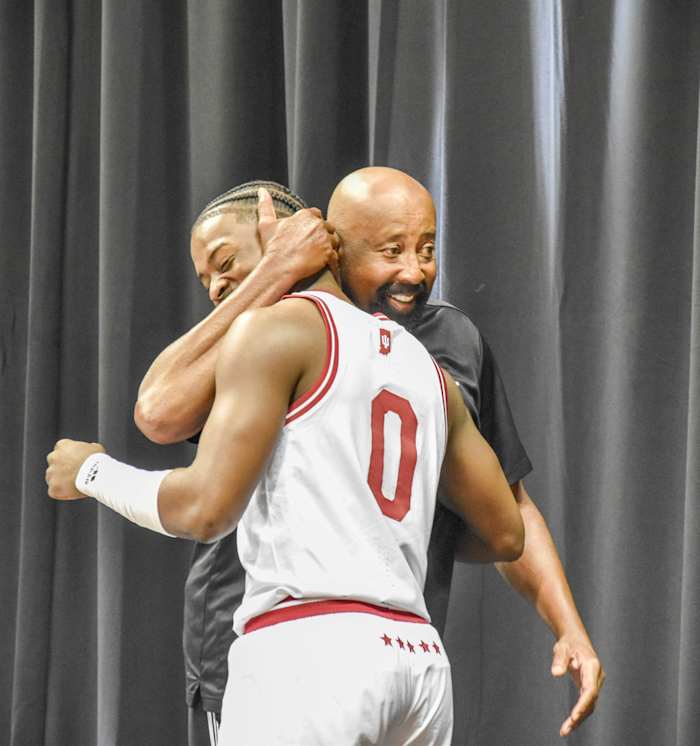 Indiana coach Mike Woodson embraces senior Xavier Johnson as he takes the stage for IU Basketball Media Day at Simon Skjodt Assembly Hall.
